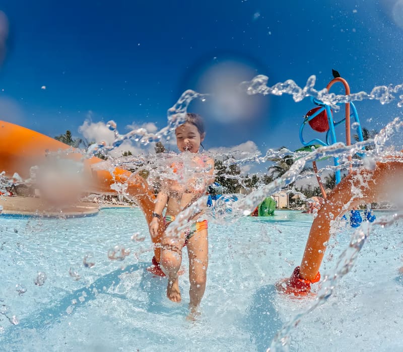 Child splashing in a pool